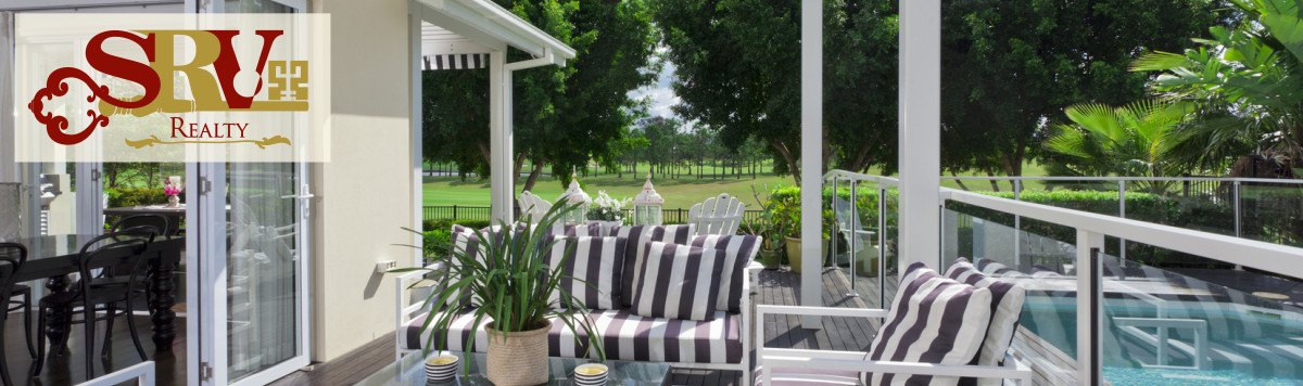 A classic patio with black striped cushions