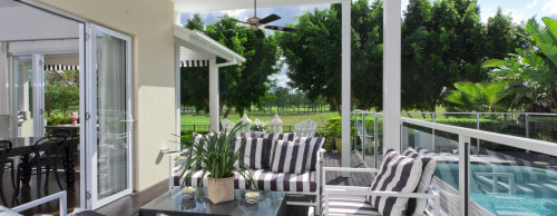 A classic patio with black striped cushions